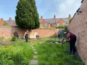 Volunteers clearing a garden