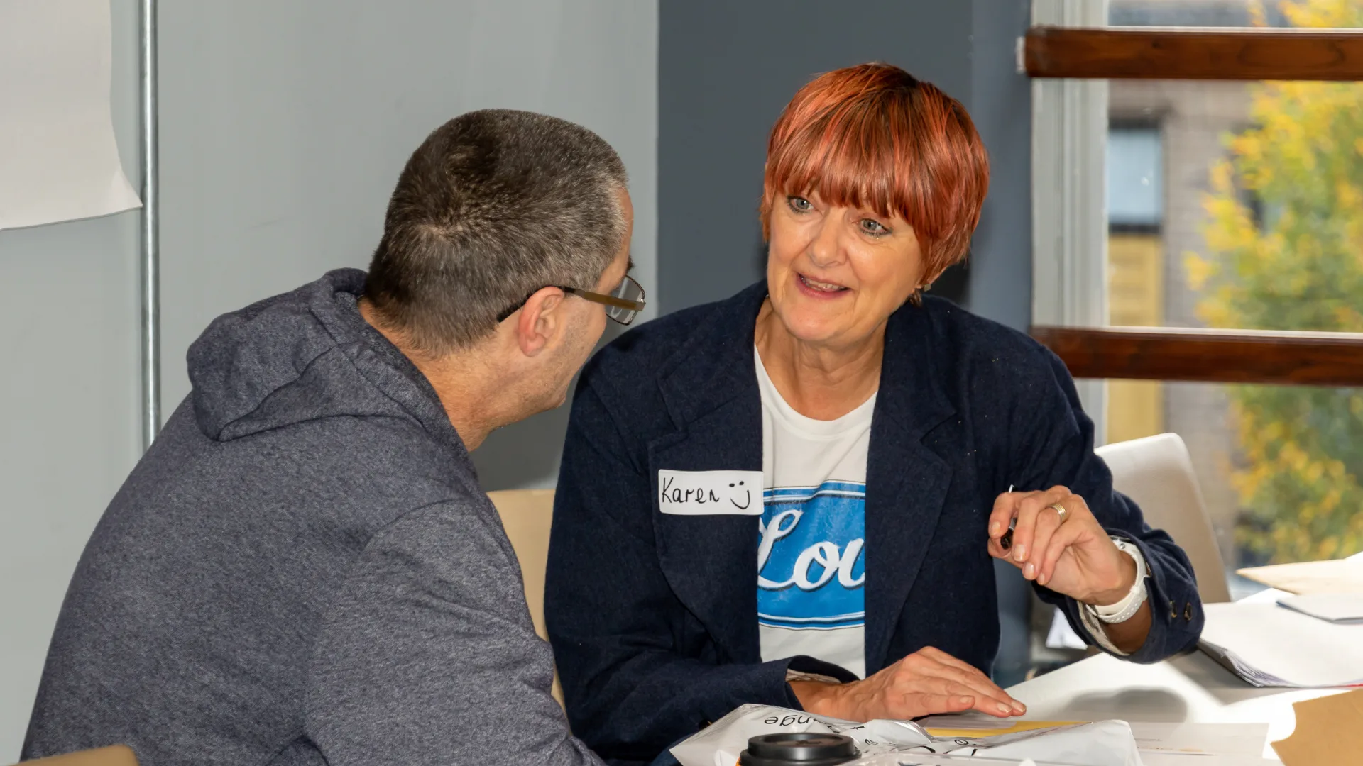 Karen talking to a homeless man.